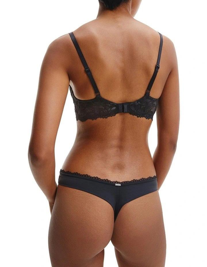 Calvin Klein Seductive Comfort Lotus Floral Thong Brief In Black 2 Calvin Klein Seductive Comfort Lotus Floral Thong Brief In Black - Image 2